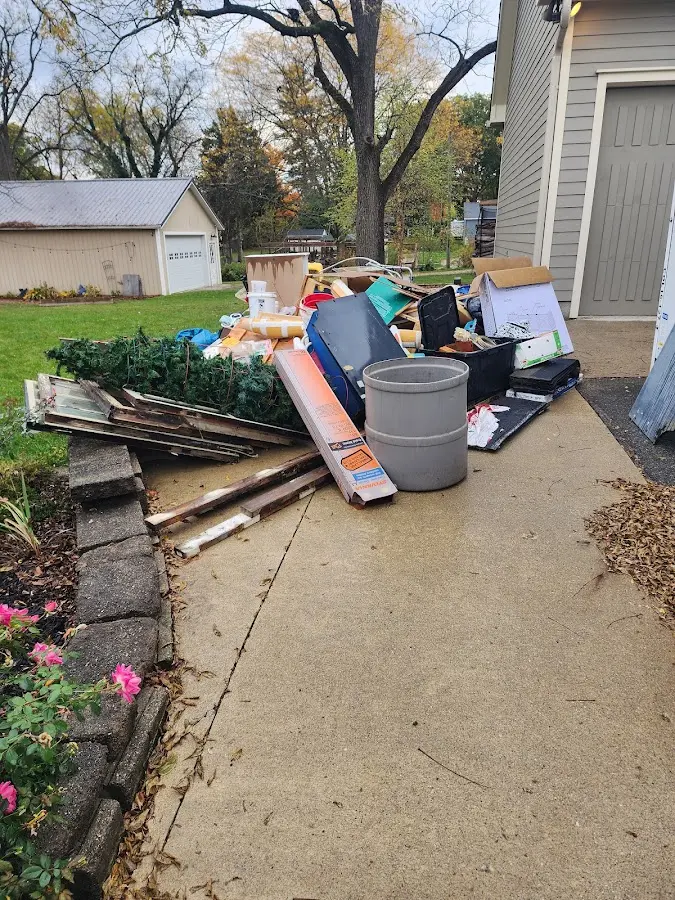 Dumpster being loaded with debris for Estate Cleanout Dumpster Rental in Spotsylvania Courthouse